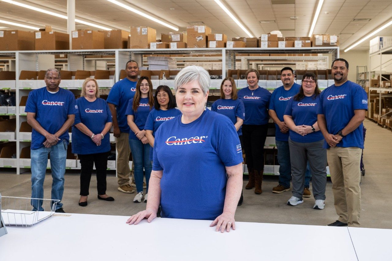 Image of Frances Snipes with her merchandising team behind her